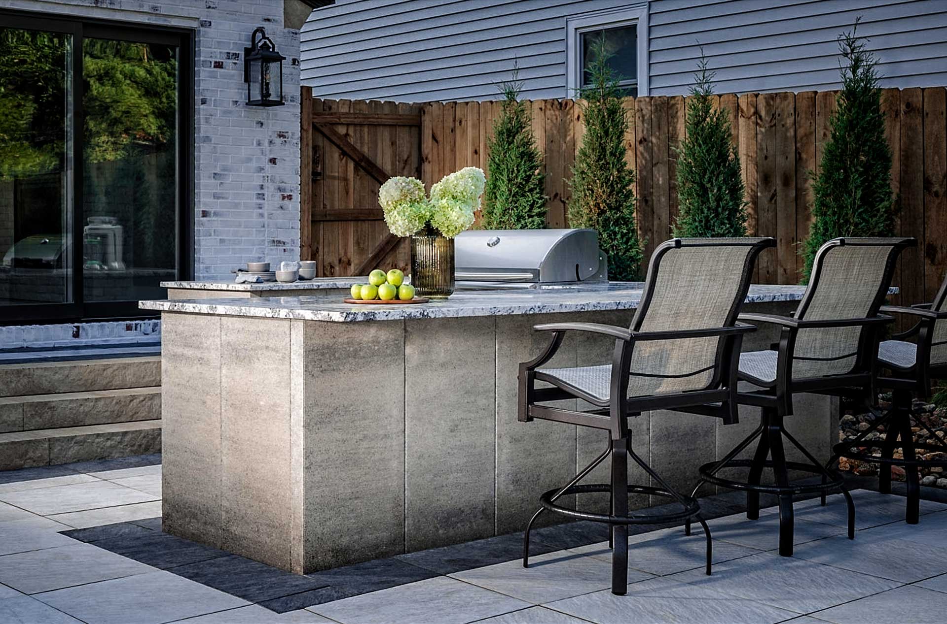 Belgard-Outdoor-Kitchen Custom designed outdoor kitchen and entertainment, featuring Belgard Artforms and grill
