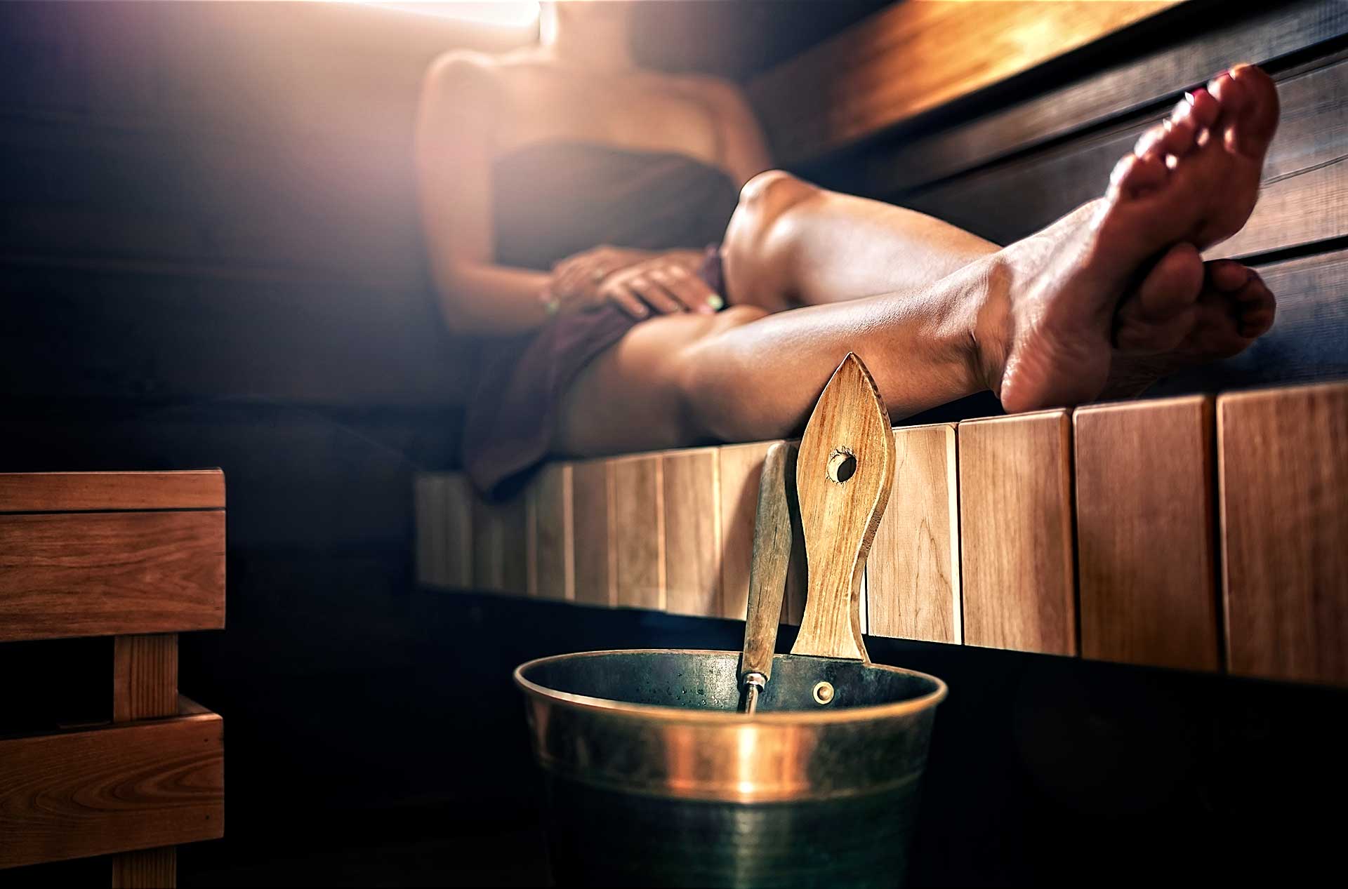 Experience-Design-Pro-Sauna-1 Sauna in use, mood shot showcasing comfort of a custom sauna.